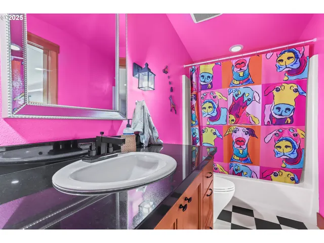 a bathroom with a sink a bath tub and a mirror