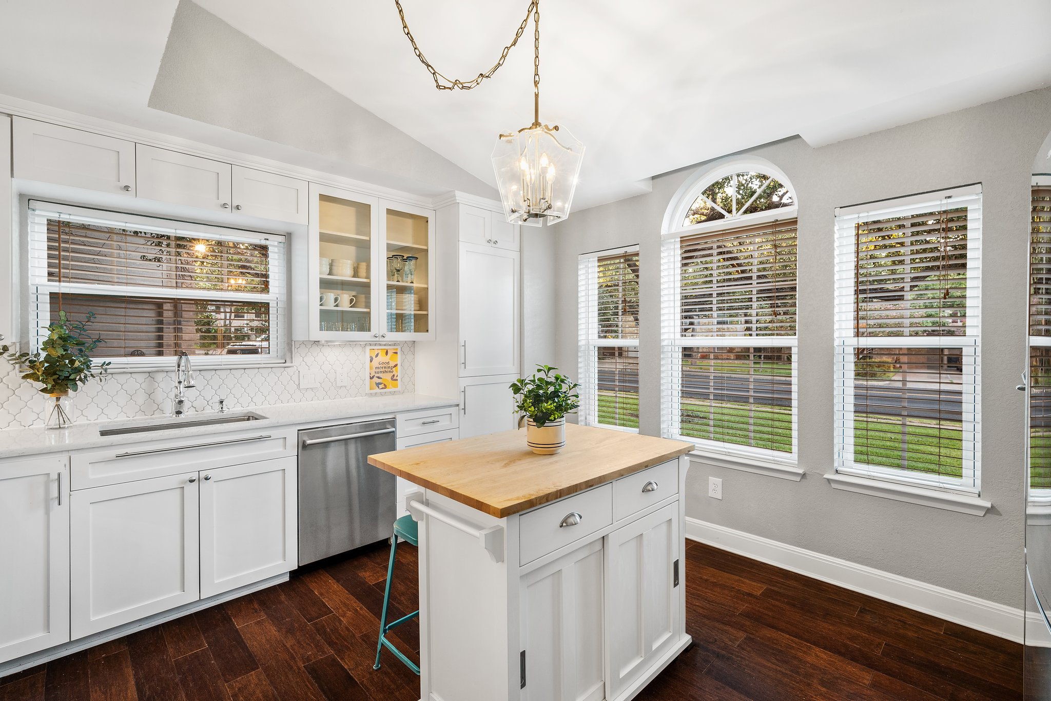 7601 Dallas Drive Austin, TX 78729 - Photo 3 of 20 a kitchen with a sink stove and cabinets
