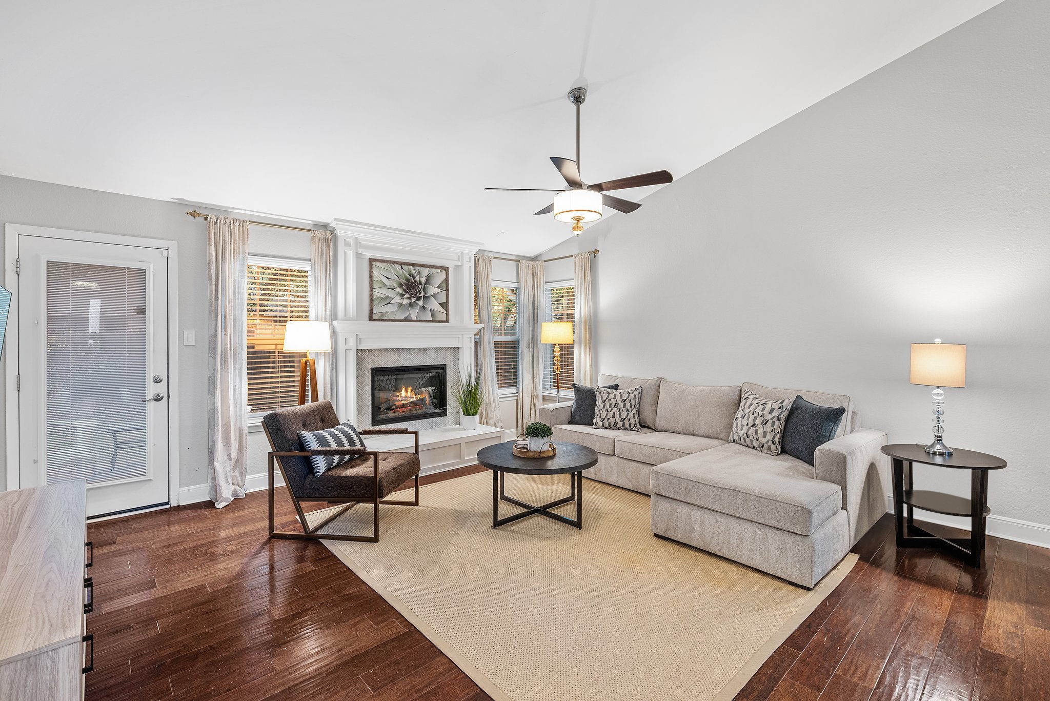7601 Dallas Drive Austin, TX 78729 - Photo 8 of 20 a living room with furniture and a fireplace
