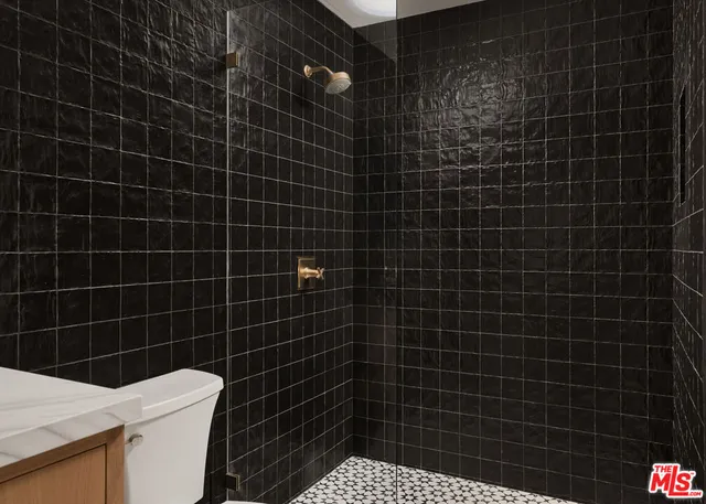 a bathroom with a sink toilet and blue