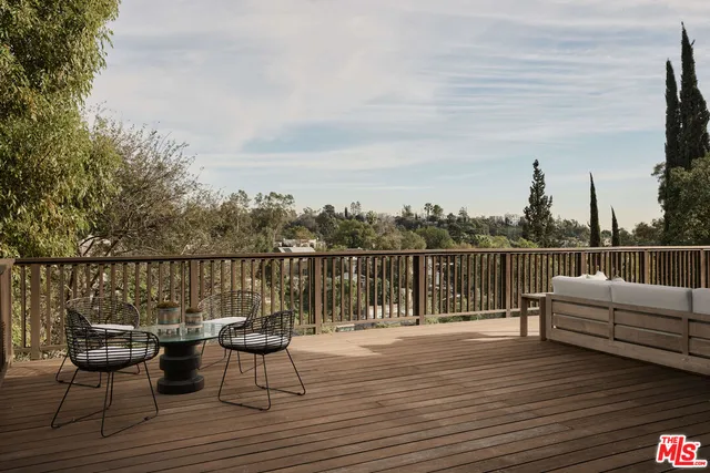 a view of a lake with sitting area