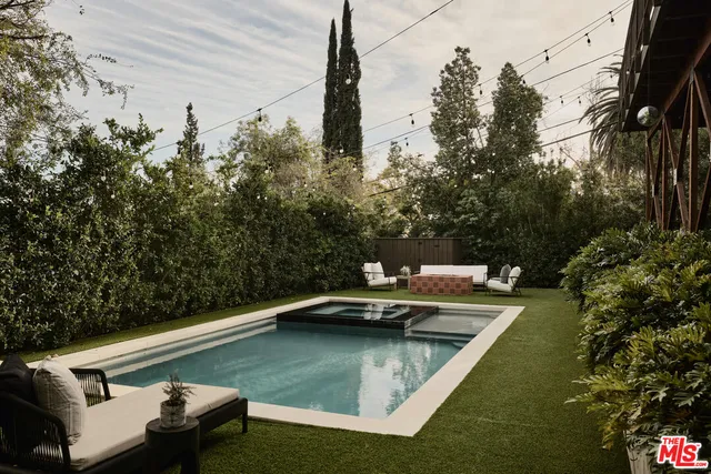a view of a swimming pool with a yard