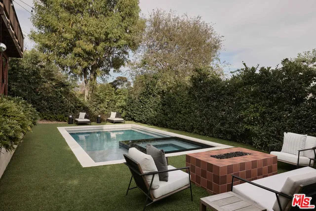 a view of a patio with swimming pool