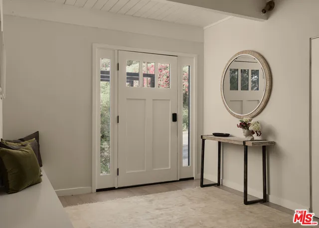 a view of a livingroom with a mirror