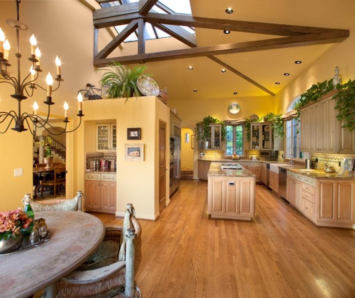 899 Park Lane Montecito, CA 93108 - Photo 8 of 14 a kitchen with stainless steel appliances granite countertop a refrigerator a sink dishwasher a dining table and chairs with wooden floor