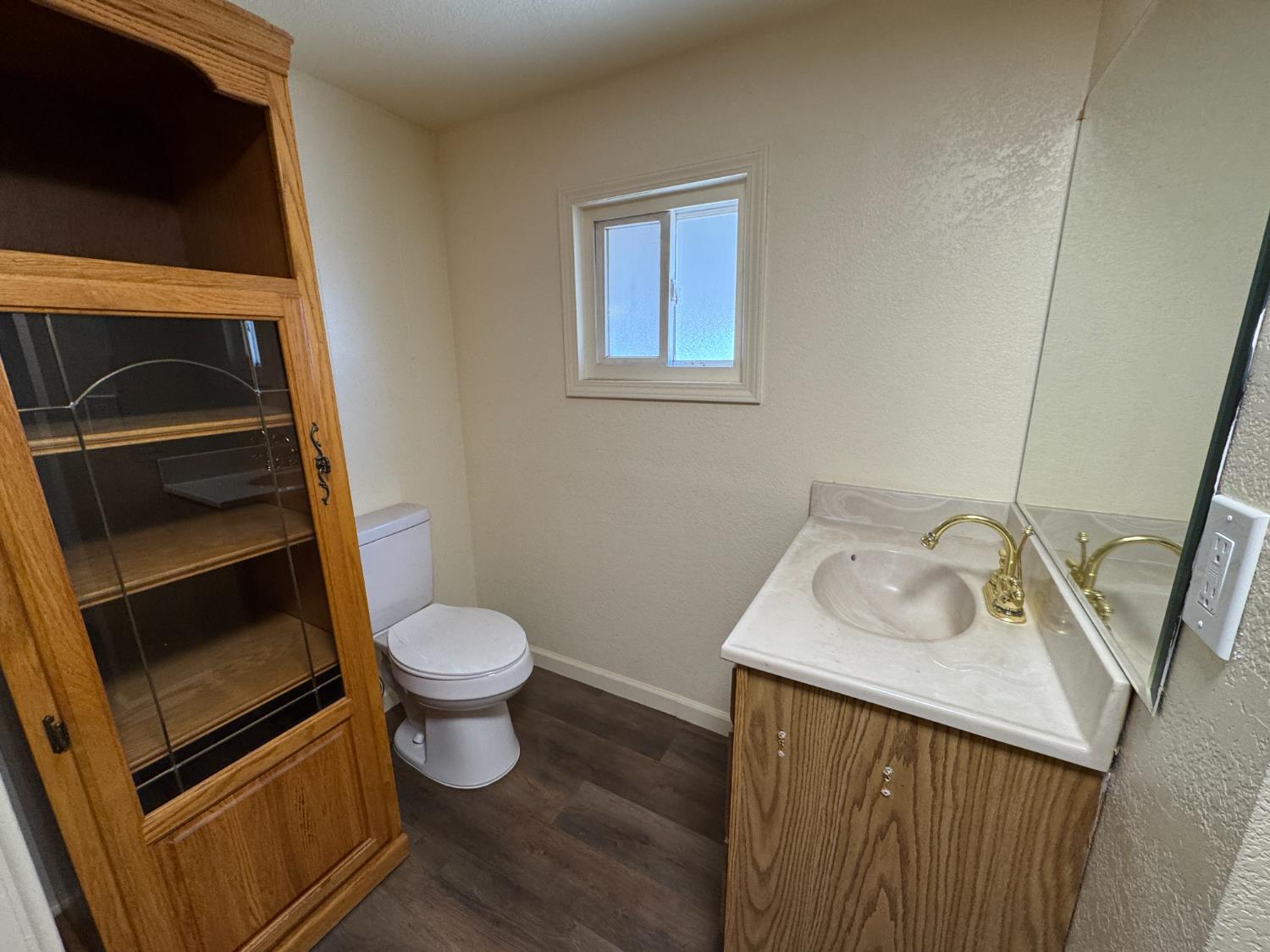 612 Union Street Isleton, CA 95641 - Photo 13 of 19 a bathroom with a sink toilet and vanity