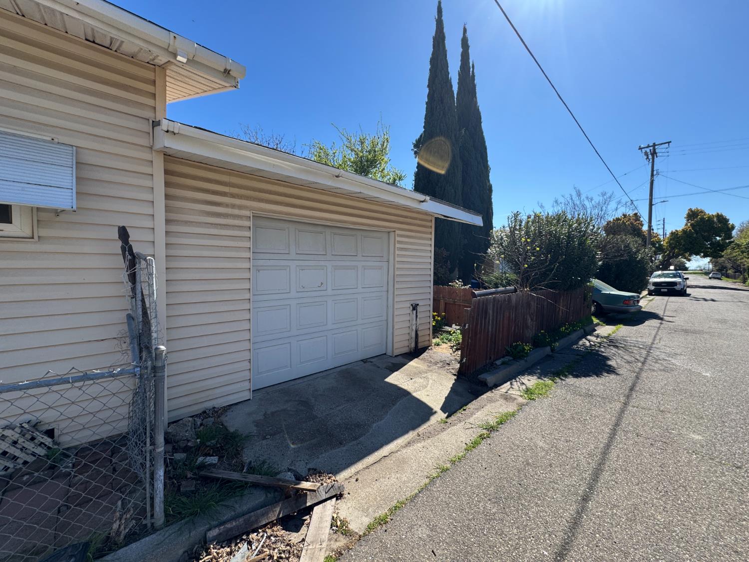 612 Union Street Isleton, CA 95641 - Photo 15 of 19 a view of backyard with wheel chair potted plants and wooden fence