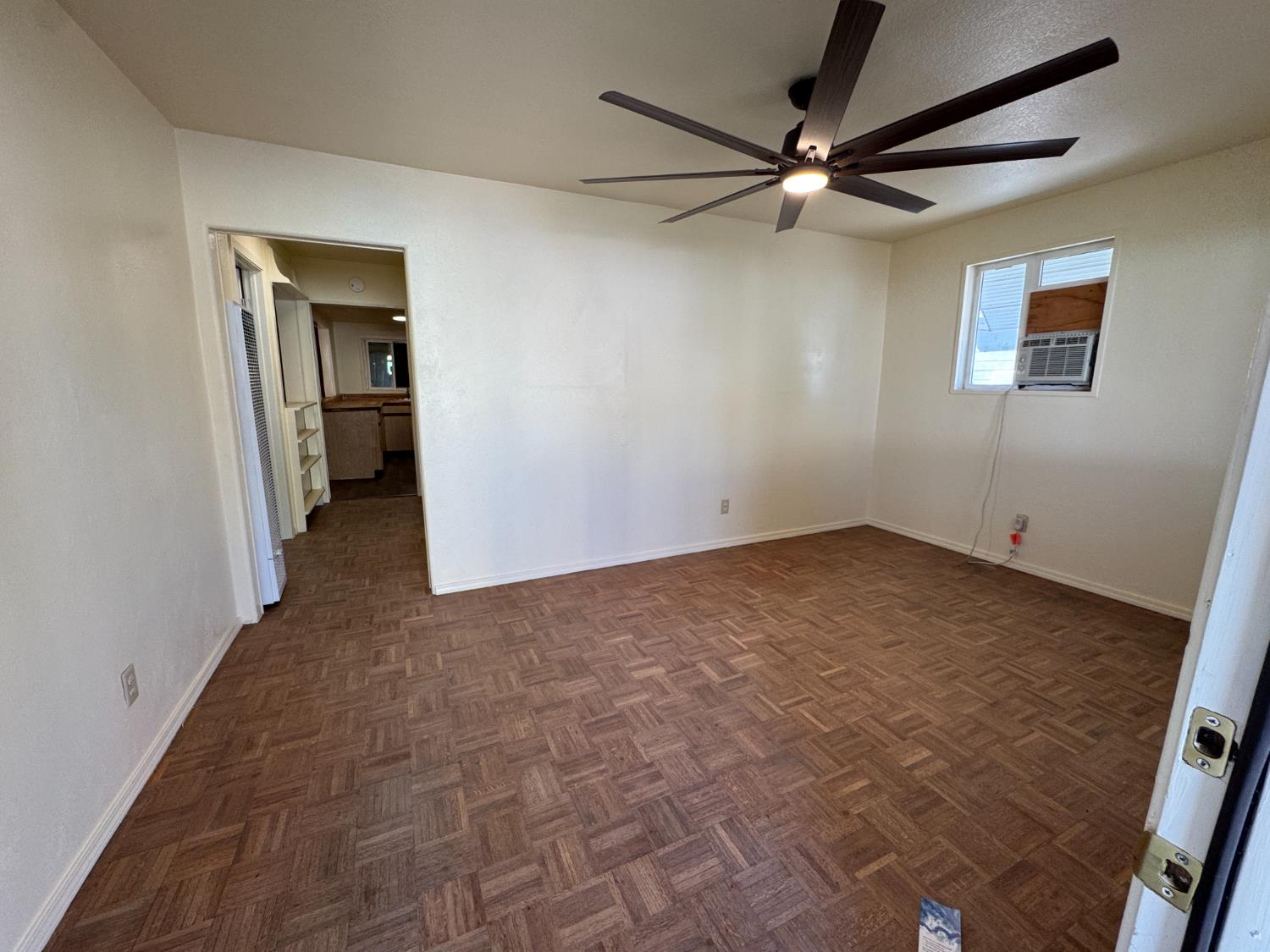 612 Union Street Isleton, CA 95641 - Photo 3 of 19 a view of a hallway with a ceiling fan