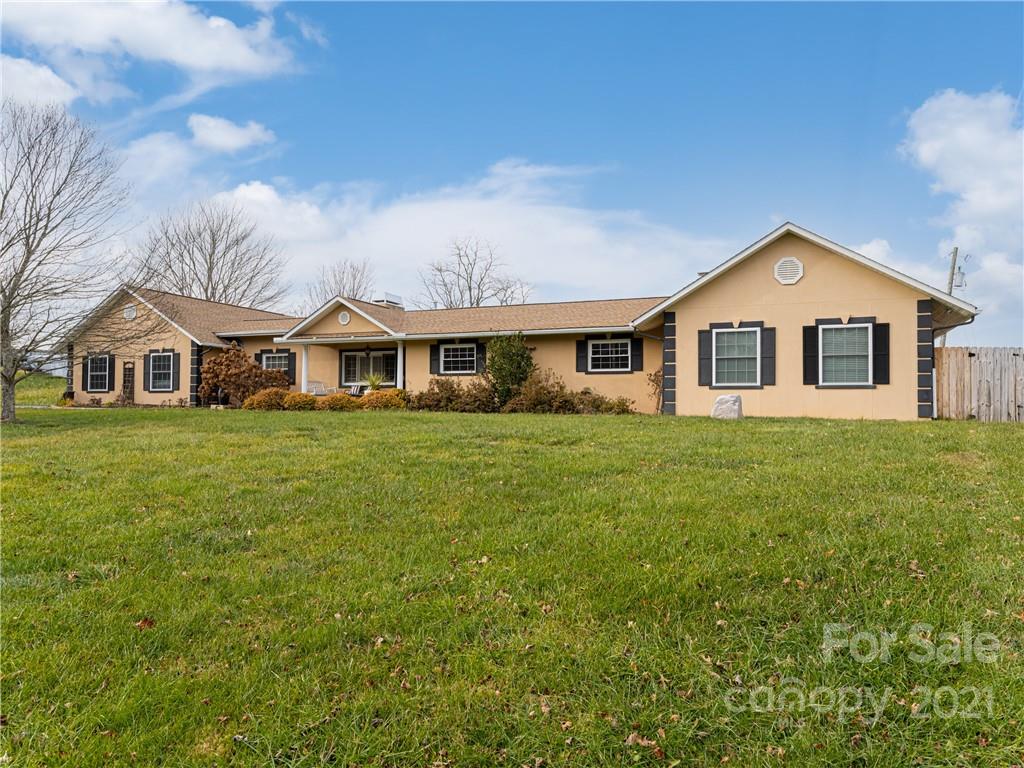 333 Gouges Branch Road Leicester, NC 28748 - Photo 1 of 48 a front view of a house with a yard