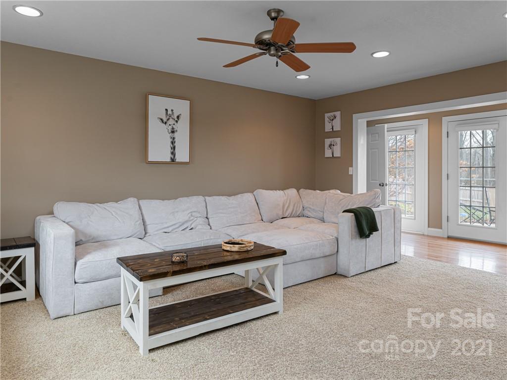 333 Gouges Branch Road Leicester, NC 28748 - Photo 11 of 48 a living room with furniture and a ceiling fan