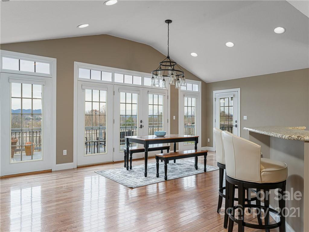 333 Gouges Branch Road Leicester, NC 28748 - Photo 13 of 48 a living room with furniture a table and wooden floor