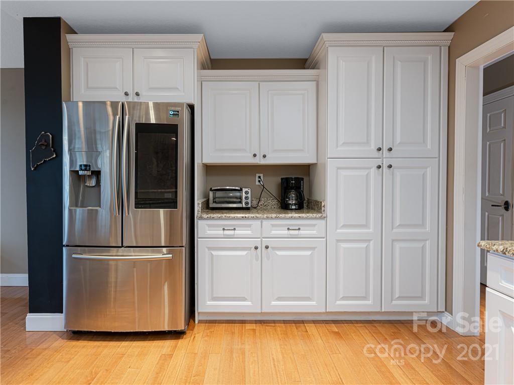 333 Gouges Branch Road Leicester, NC 28748 - Photo 19 of 48 a kitchen with stainless steel appliances granite countertop a refrigerator and cabinets