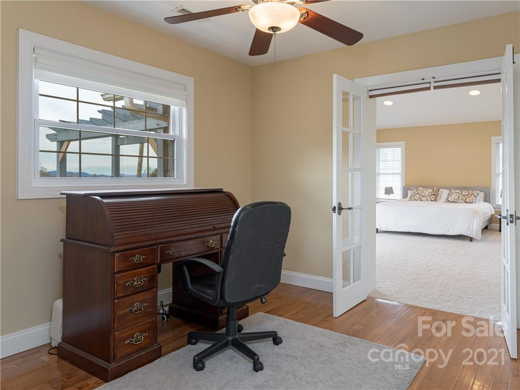 333 Gouges Branch Road Leicester, NC 28748 - Photo 26 of 48 a view of a workspace with furniture and a window