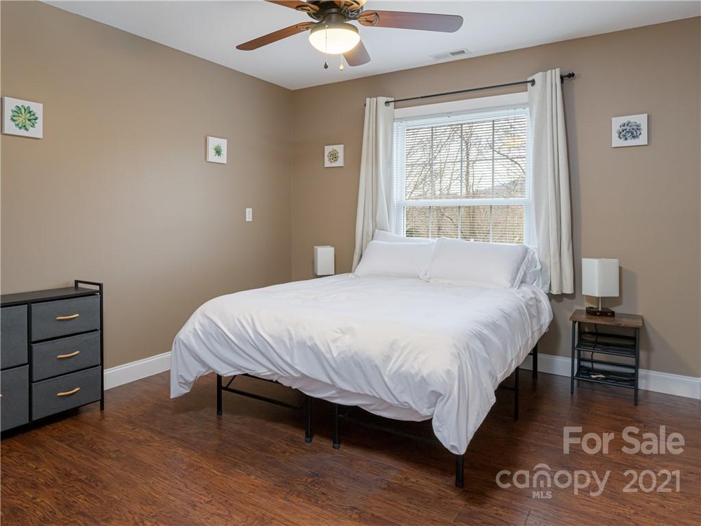 333 Gouges Branch Road Leicester, NC 28748 - Photo 30 of 48 a bedroom with a bed and a window