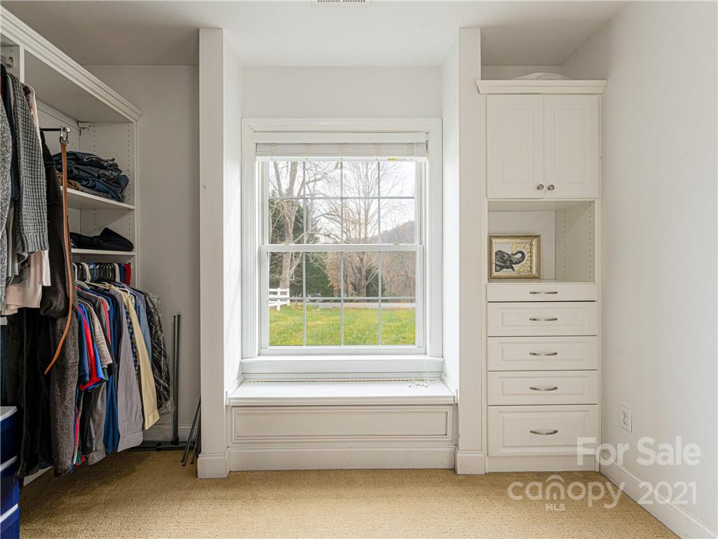 333 Gouges Branch Road Leicester, NC 28748 - Photo 31 of 48 a view of walk in closet with clothes and shoes