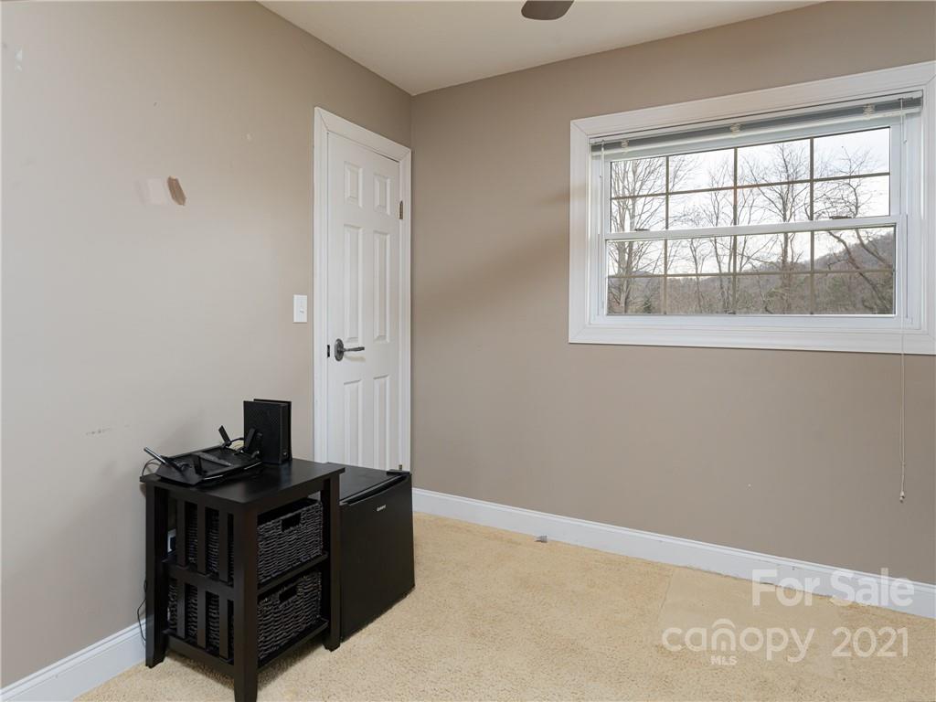 333 Gouges Branch Road Leicester, NC 28748 - Photo 32 of 48 an empty room with a window