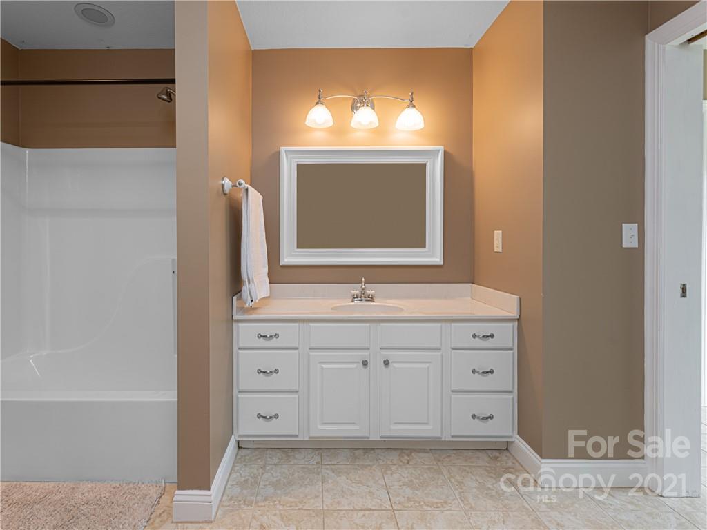 333 Gouges Branch Road Leicester, NC 28748 - Photo 36 of 48 a bathroom with a sink double vanity and a bathtub