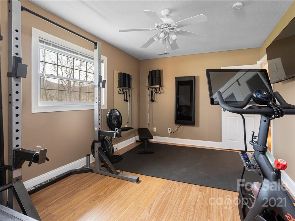333 Gouges Branch Road Leicester, NC 28748 - Photo 37 of 48 a room with gym equipment and view of living room