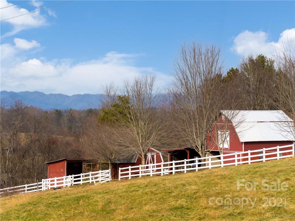 333 Gouges Branch Road Leicester, NC 28748 - Photo 5 of 48 a view of a swimming pool with an outdoor seating