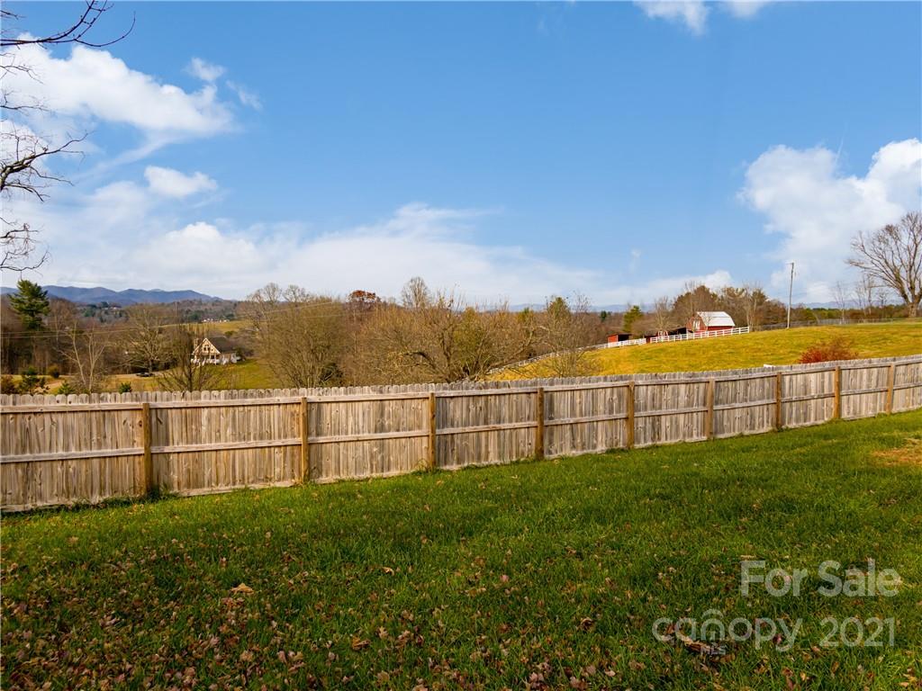 333 Gouges Branch Road Leicester, NC 28748 - Photo 44 of 48 a view of a terrace with a garden