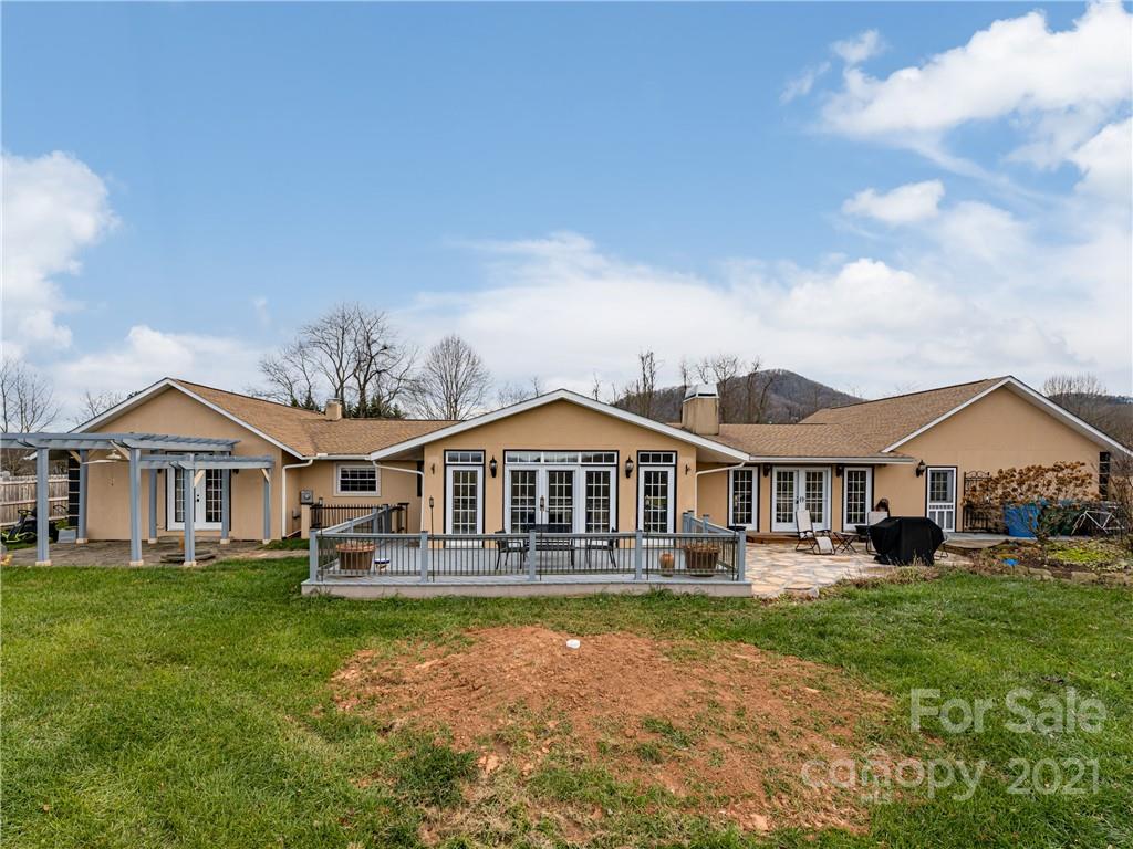 333 Gouges Branch Road Leicester, NC 28748 - Photo 47 of 48 a front view of a house with a yard table and chairs