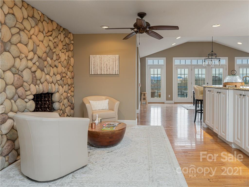 333 Gouges Branch Road Leicester, NC 28748 - Photo 6 of 48 a living room with a couch and a chandelier