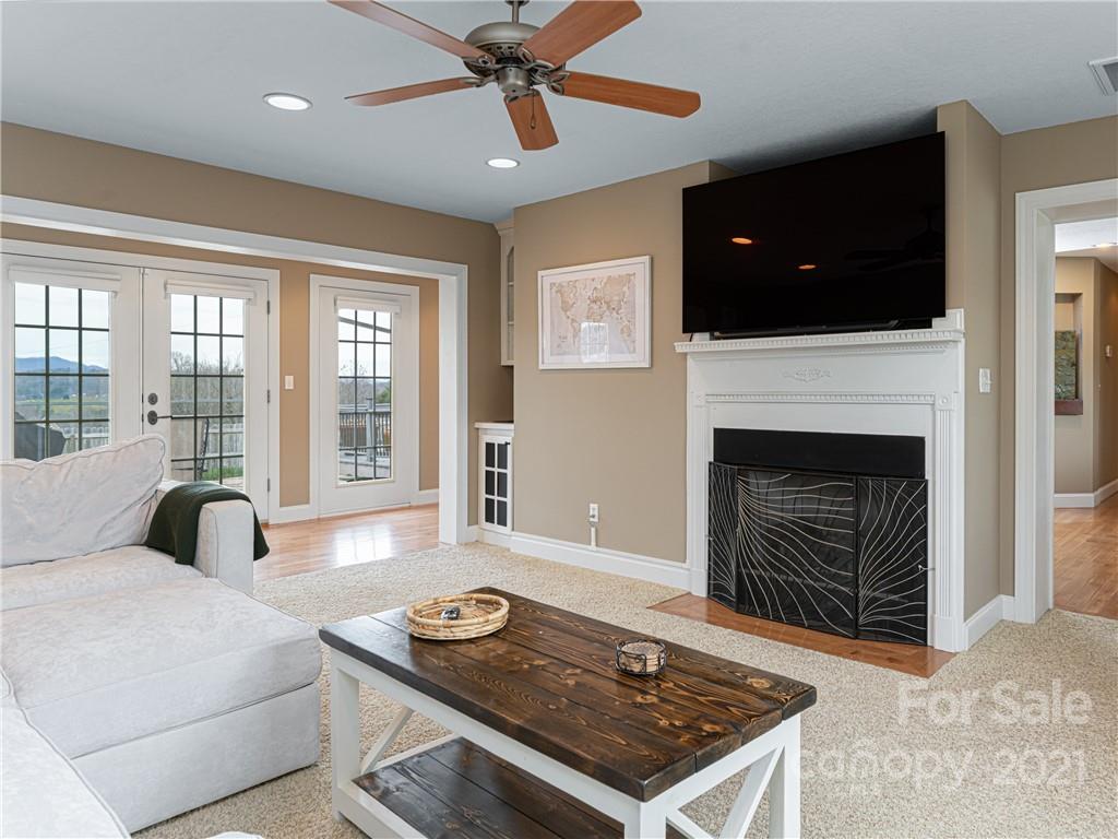 333 Gouges Branch Road Leicester, NC 28748 - Photo 9 of 48 a living room with furniture and a fireplace