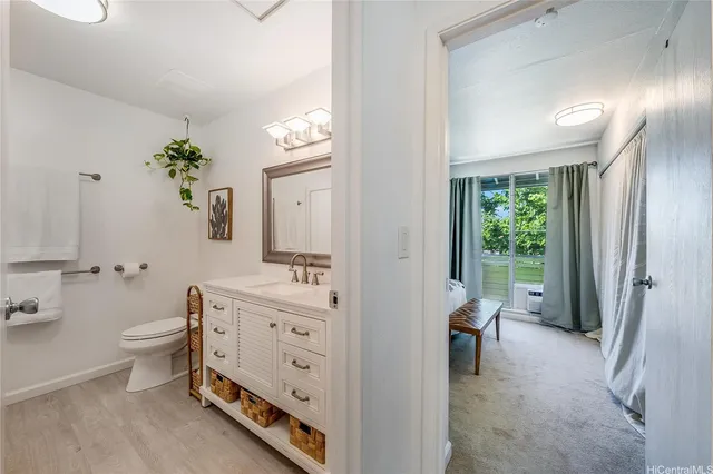 a spacious bathroom with a double vanity sink a mirror and a bathtub