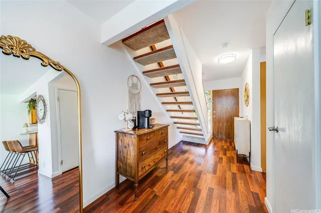 a view of entryway with wooden floor