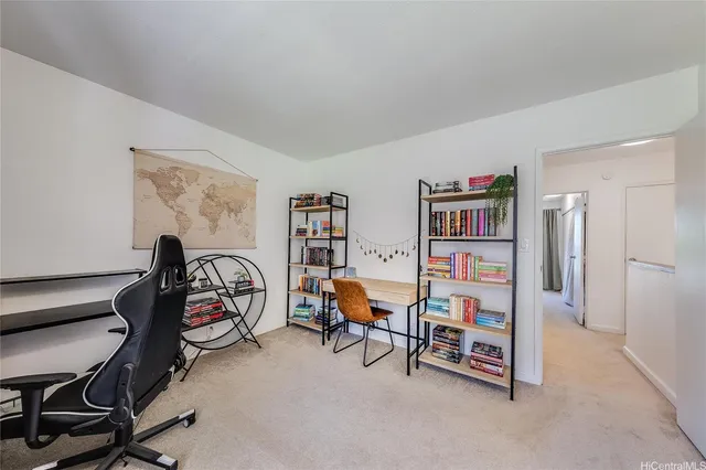 a view of a workspace with furniture