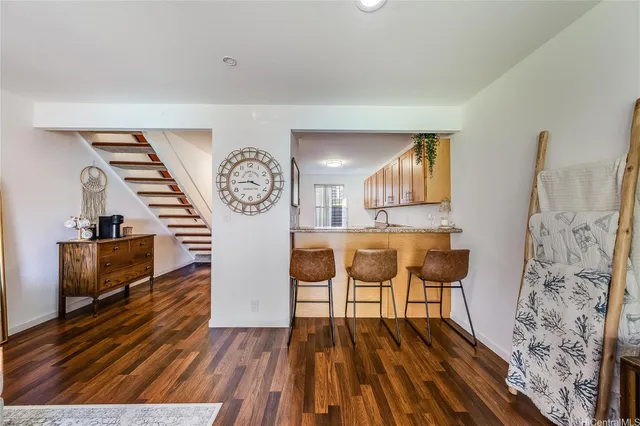 a view of a livingroom with furniture and wooden floor