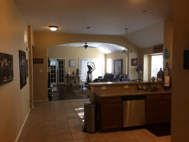 a view of living room with granite countertop furniture and fireplace