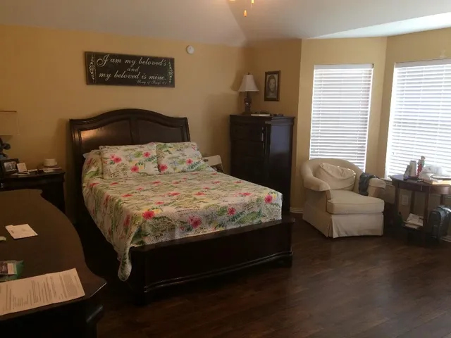 a bedroom with a bed and a couch
