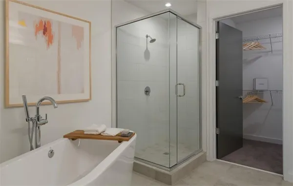 a bathroom with a tub and shower