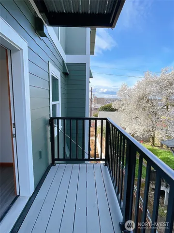 a view of a balcony with wooden floor