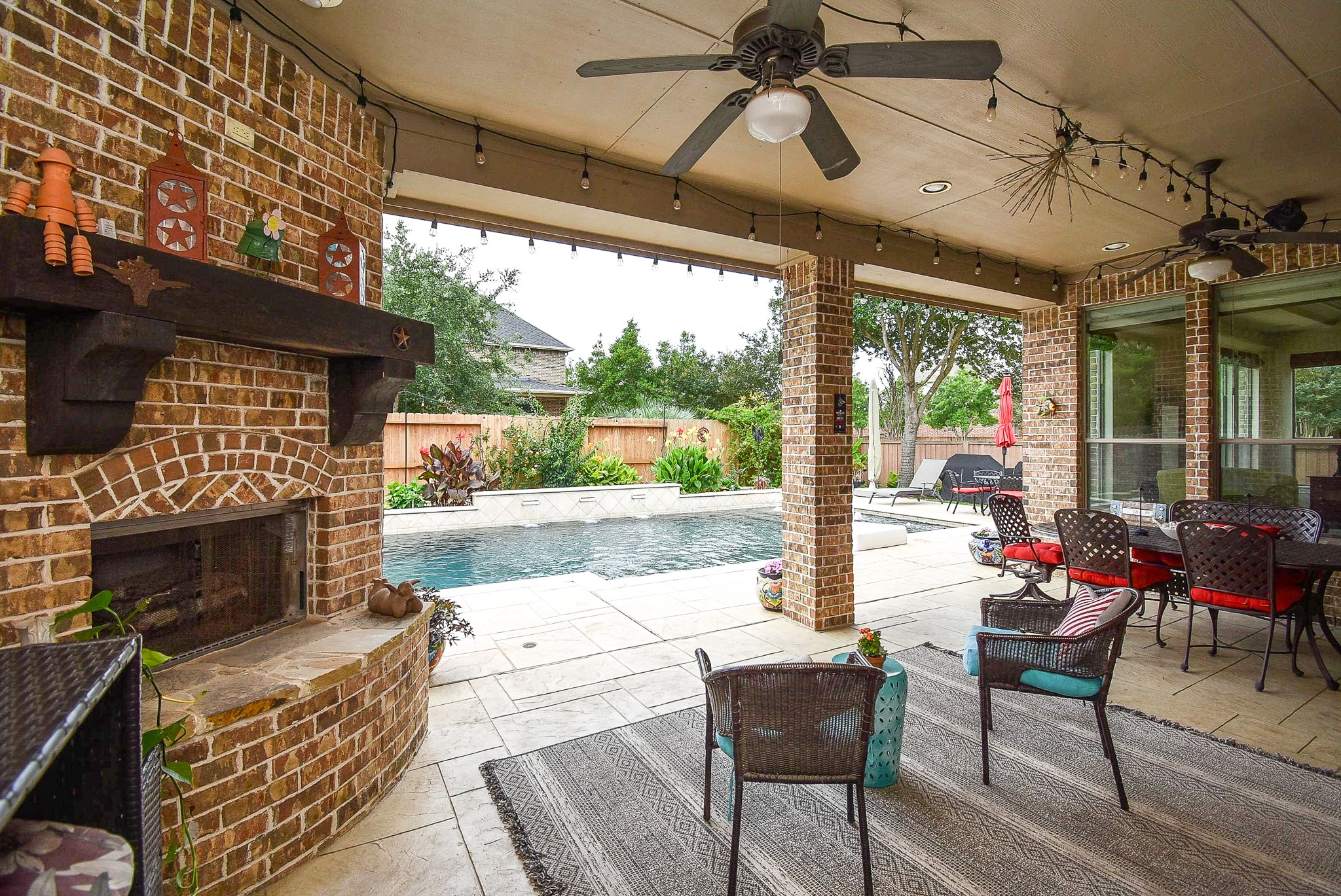 27427 Guthrie Ridge Lane Katy, TX 77494 - Photo 43 of 48 a outdoor space with the couches and a fireplace