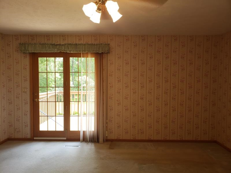 17347 Stimes Road Capron, IL 61012 - Photo 14 of 25 an empty room with wooden floor and windows
