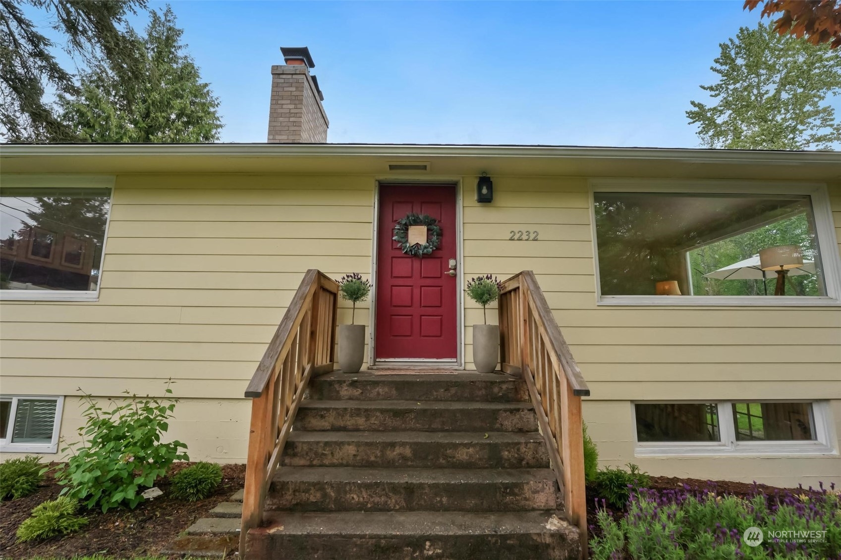 2232 South 330th Street Federal Way, WA 98003 - Photo 22 of 39 a front view of a house with a garden