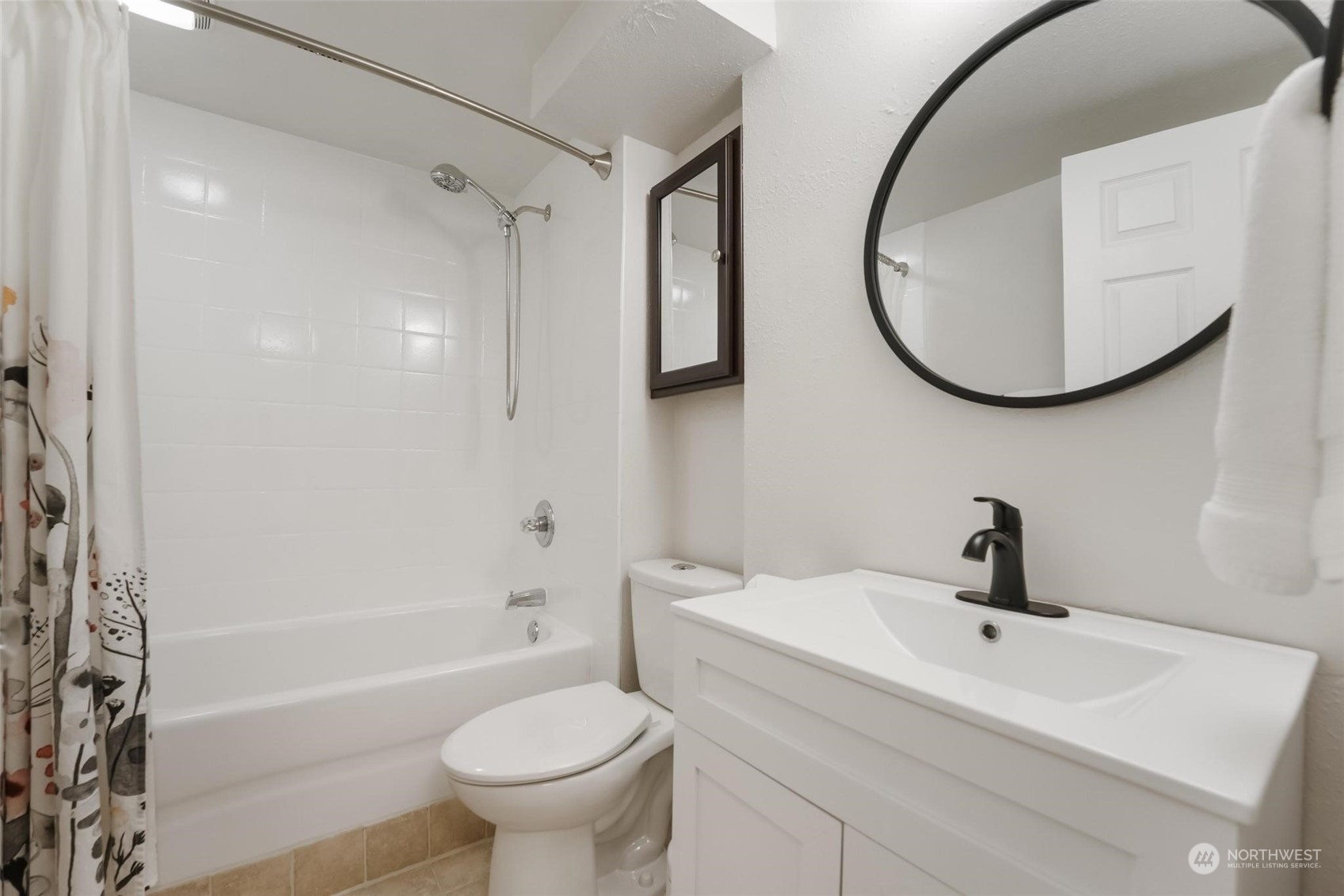 2232 South 330th Street Federal Way, WA 98003 - Photo 35 of 39 a bathroom with a sink a toilet and a mirror