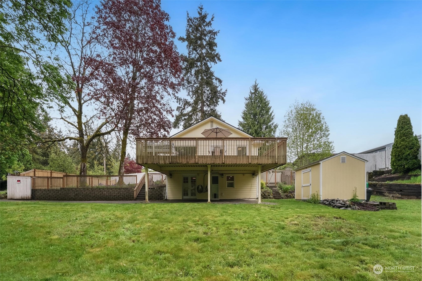 2232 South 330th Street Federal Way, WA 98003 - Photo 38 of 39 a view of a house with backyard and a garden