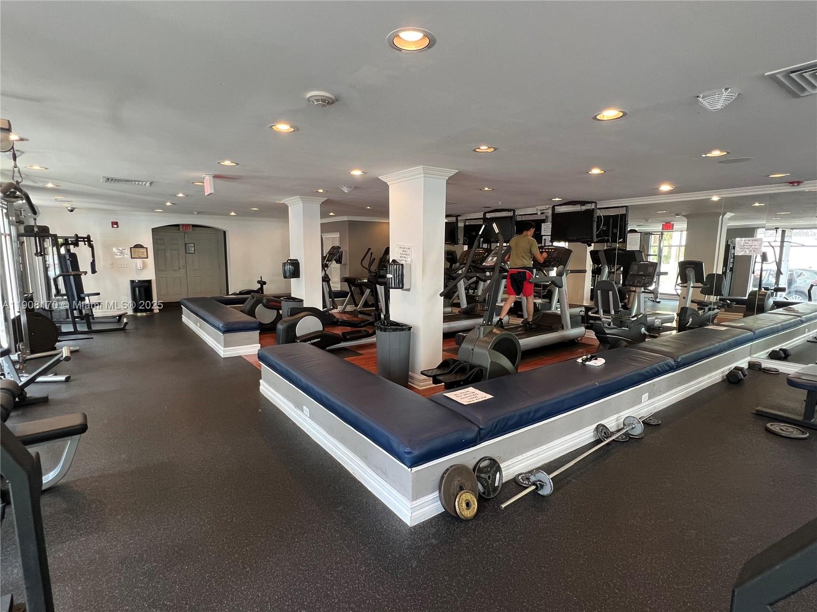 1919 Van Buren Street, Unit 720A Hollywood, FL 33020 - Photo 13 of 22 a room with gym equipment and kitchen view