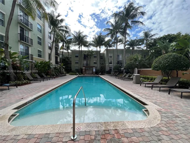 a kitchen with a sink and stainless steel appliances