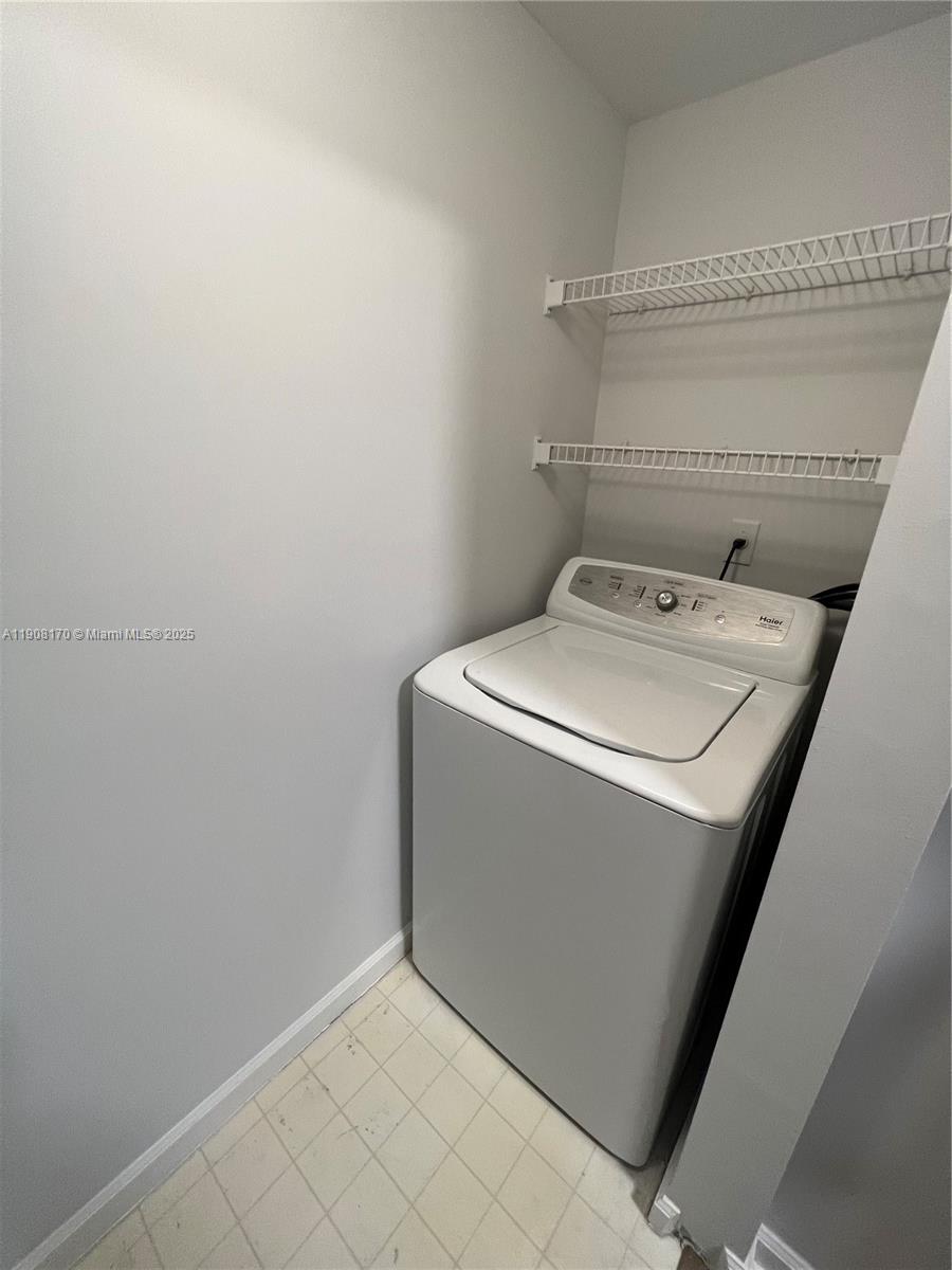 1919 Van Buren Street, Unit 720A Hollywood, FL 33020 - Photo 19 of 22 a utility room with dryer and washer