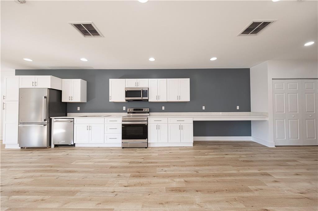 232 3rd Avenue, Unit 3 Carnegie, PA 15106 - Photo 12 of 21 a kitchen with stainless steel appliances kitchen island granite countertop a stove and a refrigerator