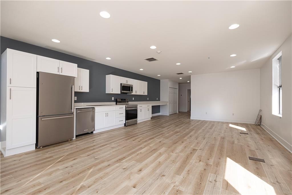 232 3rd Avenue, Unit 3 Carnegie, PA 15106 - Photo 13 of 21 a kitchen with a refrigerator and a stove top oven