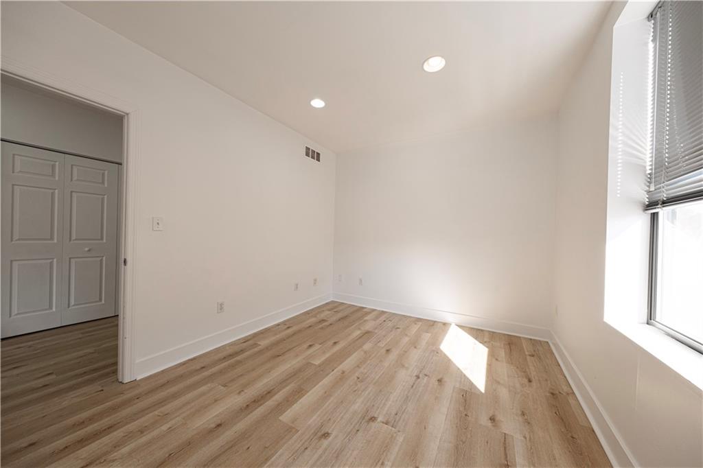 232 3rd Avenue, Unit 3 Carnegie, PA 15106 - Photo 18 of 21 wooden floor in an empty room with a window