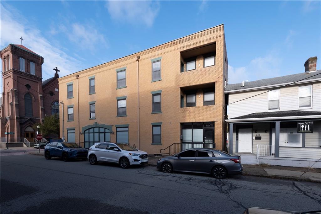 232 3rd Avenue, Unit 3 Carnegie, PA 15106 - Photo 2 of 21 a car parked in front of a building