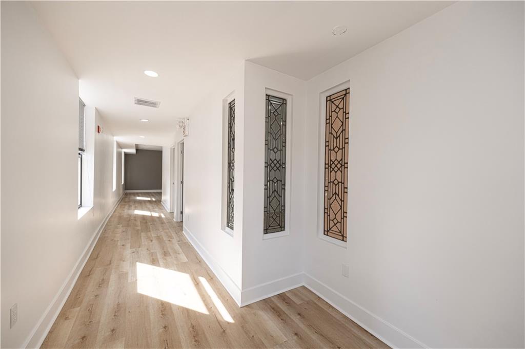 232 3rd Avenue, Unit 3 Carnegie, PA 15106 - Photo 6 of 21 a view of a hallway with wooden floor and staircase