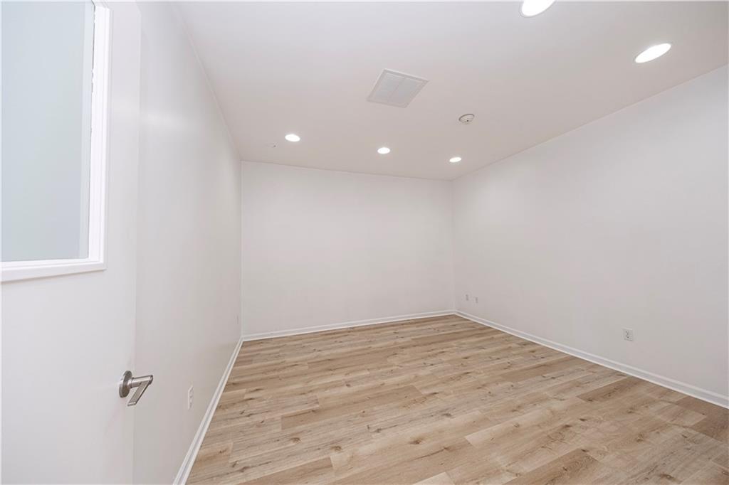 232 3rd Avenue, Unit 3 Carnegie, PA 15106 - Photo 8 of 21 a view of a room with wooden floor and white walls