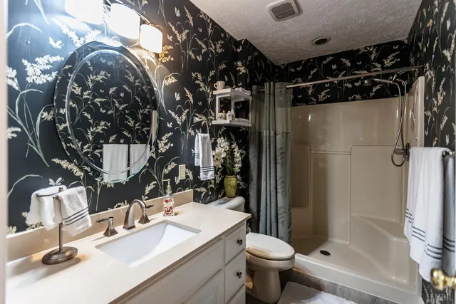 a view of gallery with wooden floor